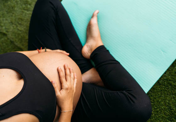 Pregnant woman in group fitness class