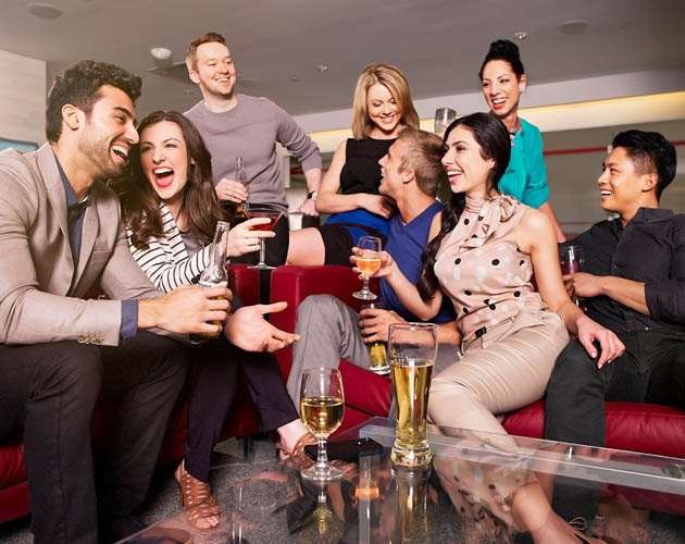 Group of people socializing in the HUB lounge