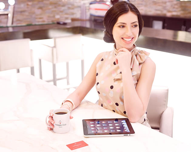 Woman working and drinking coffee at the HUB