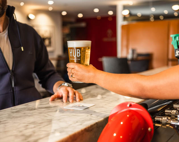 Man getting a beer at the HUB bar