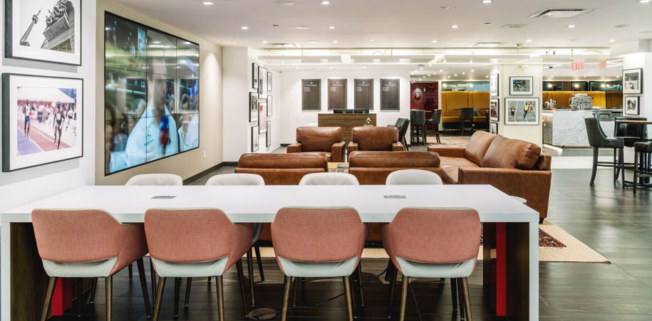 HUB lounge with couches and large screen