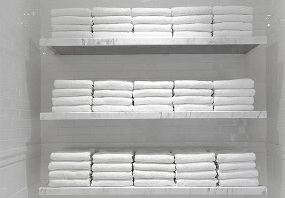 Shelves of clean towels in the women's locker room at the Adelaide Club
