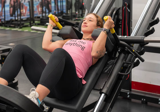 Young fit woman using the hack squat machine in our Strength Gym at the Adelaide Club