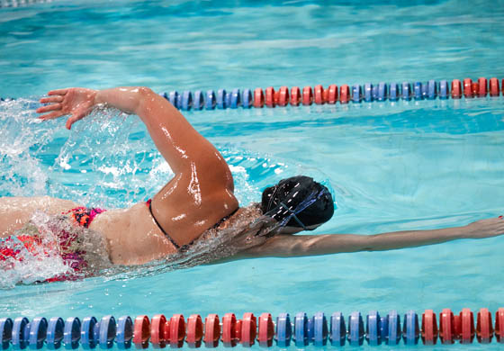 Young, athletic woman swimming in the pool at the Toronto Athletic Club